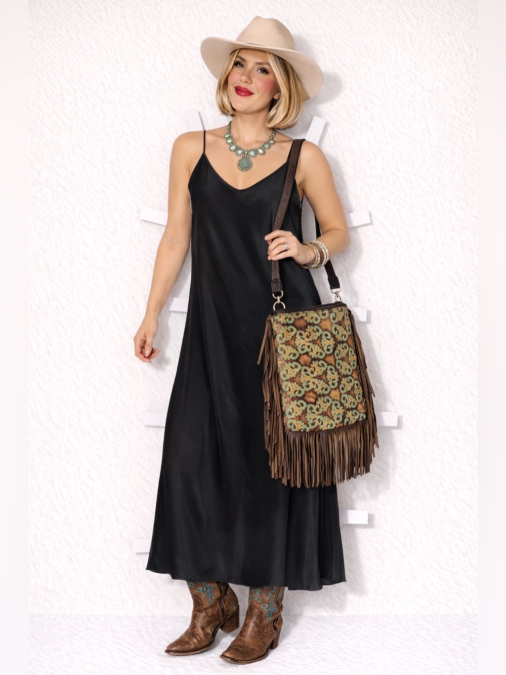 Embossed leather crossbody bag, double sided with western-style fringe, boho